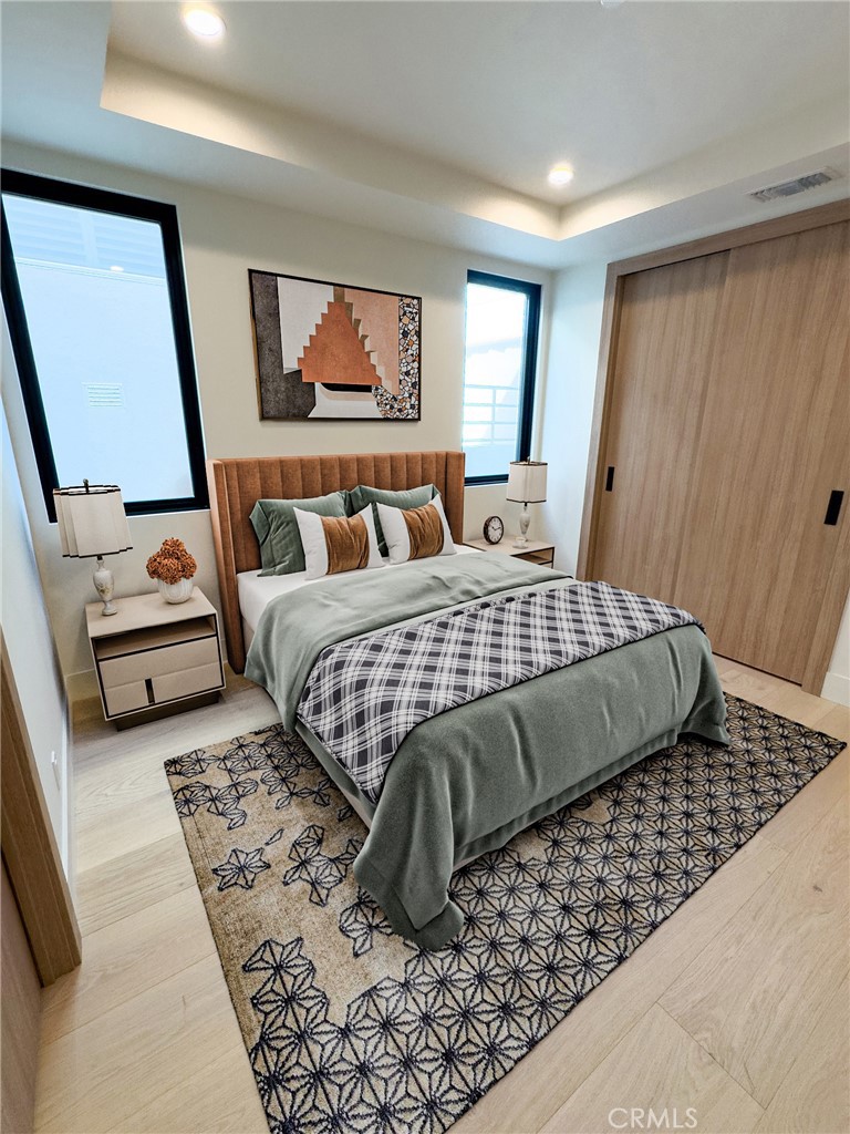 404 16th Street Manhattan Beach, CA 90266 - Photo 22 of 58 a bedroom with a large bed rug and window