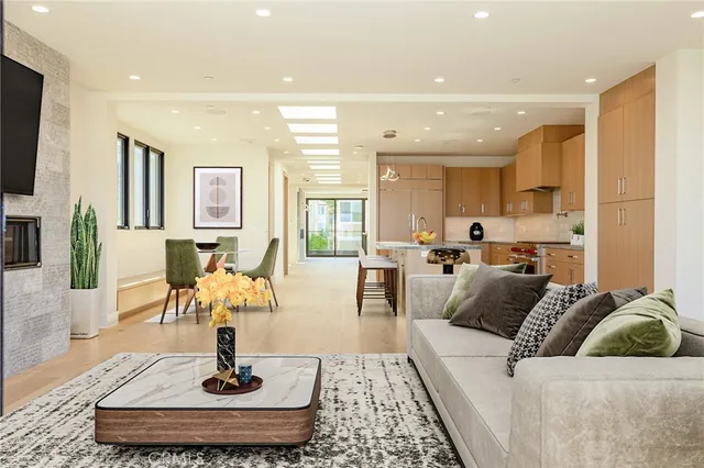 a kitchen with granite countertop cabinets stainless steel appliances and a sink