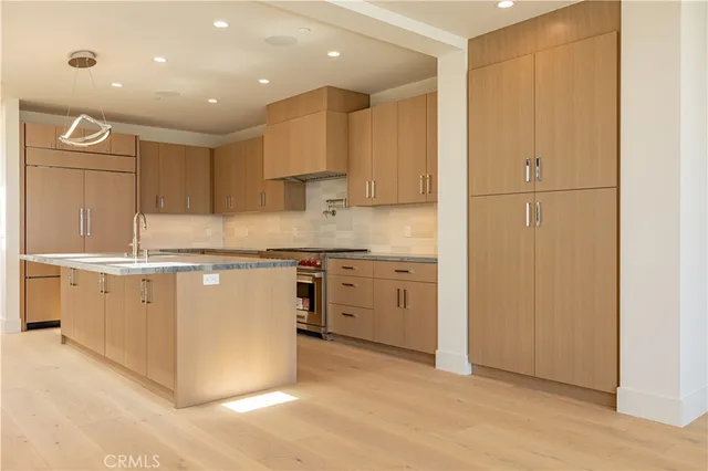 a living room with furniture wooden floor and a flat screen tv
