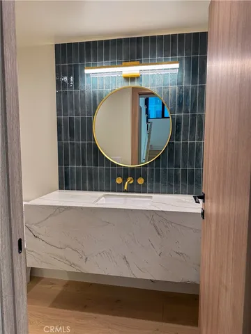 a view of a room with wooden floor and cabinet