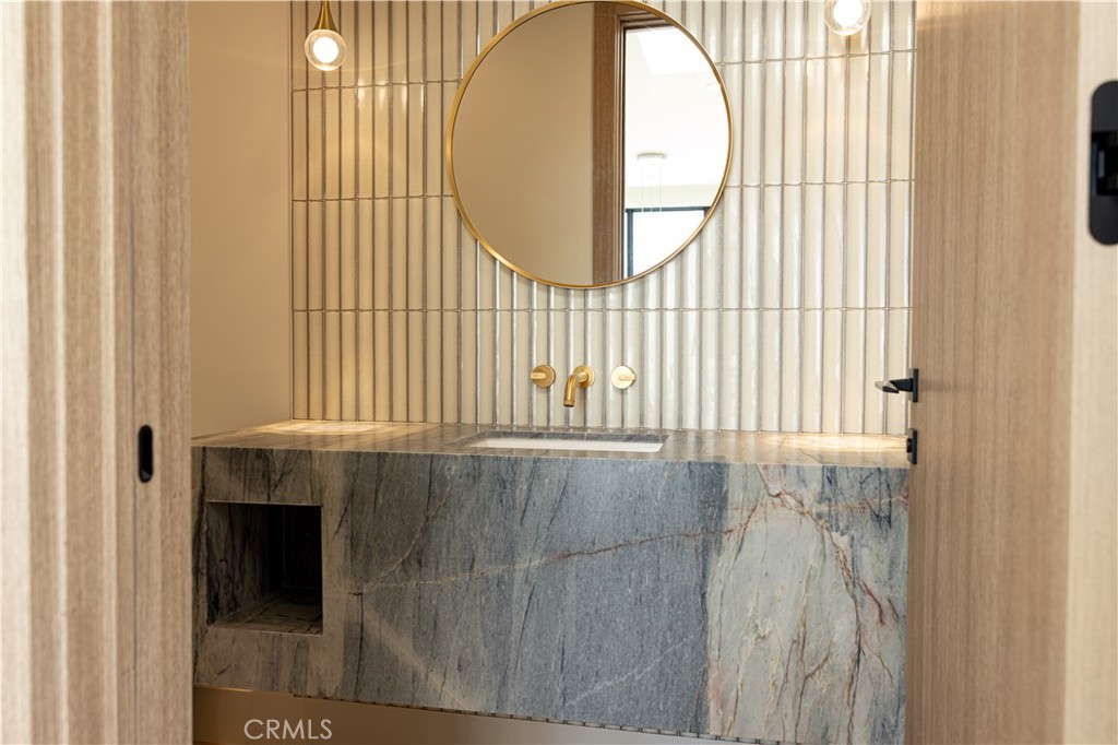 404 16th Street Manhattan Beach, CA 90266 - Photo 40 of 58 a bathroom with a window and a sink