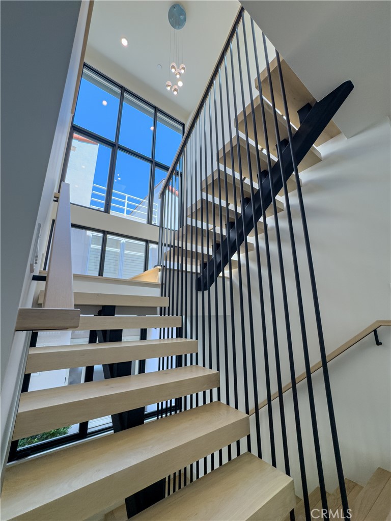 404 16th Street Manhattan Beach, CA 90266 - Photo 42 of 58 a view of staircase with white walls and a window
