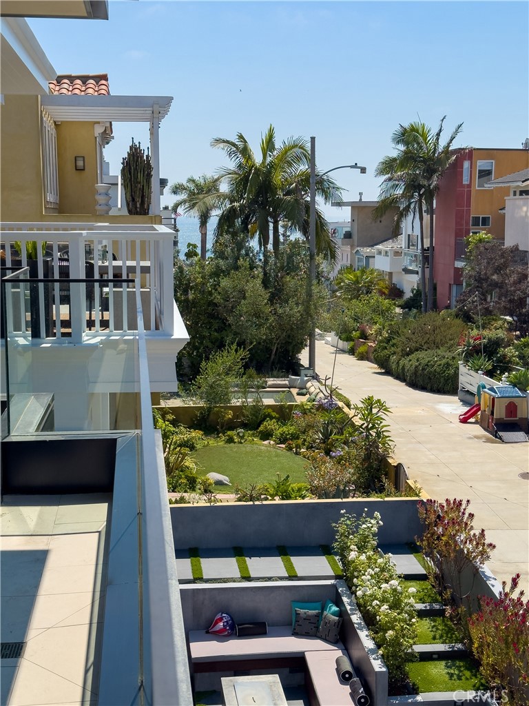 404 16th Street Manhattan Beach, CA 90266 - Photo 51 of 58 a front view of a house with a yard and potted plants
