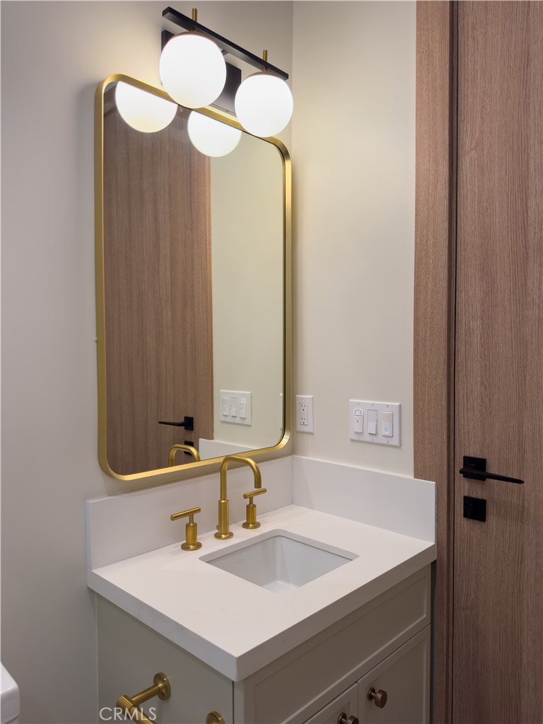 404 16th Street Manhattan Beach, CA 90266 - Photo 8 of 58 a bathroom with a sink and a mirror