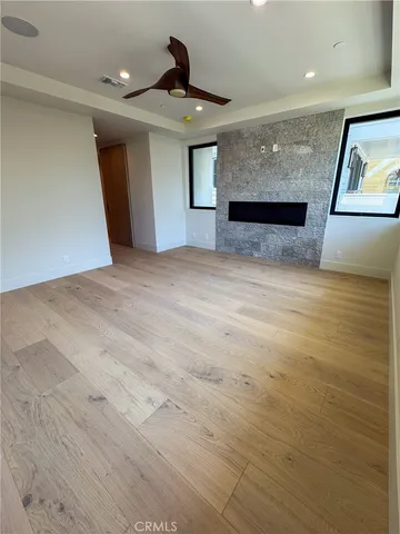 a view of a livingroom with furniture and wooden floor