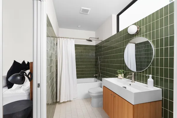 a view of a backyard with chair and garden