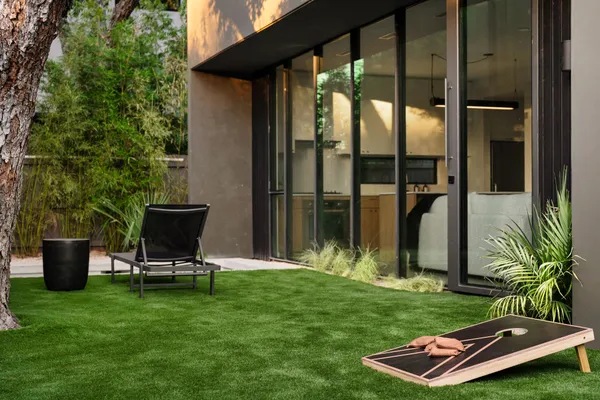 a backyard with a table and chairs