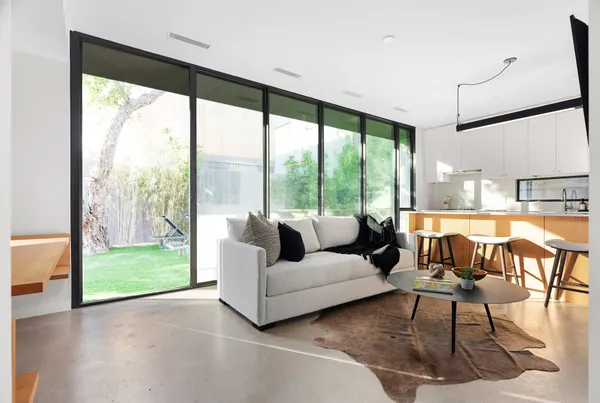a living room with furniture and a large window