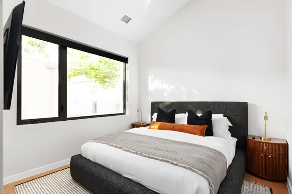 a bathroom with a double vanity sink toilet and shower