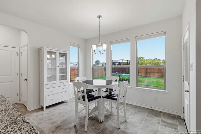 a view of a kitchen with wooden floor and a kitchen