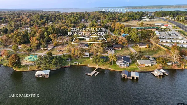 an aerial view of a house with a ocean view