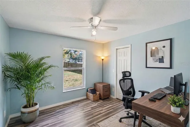 a workspace with furniture and window