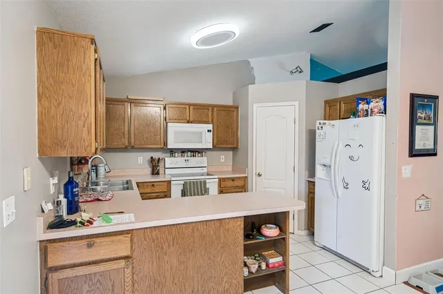 a kitchen with stainless steel appliances a refrigerator and a sink