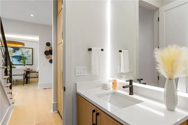 a en suite bathroom with a sink and a mirror