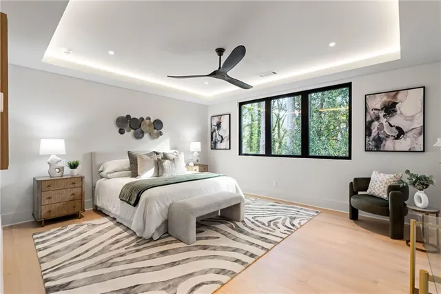 a bedroom with a large bed and a window