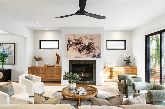 a living room with furniture and a fireplace