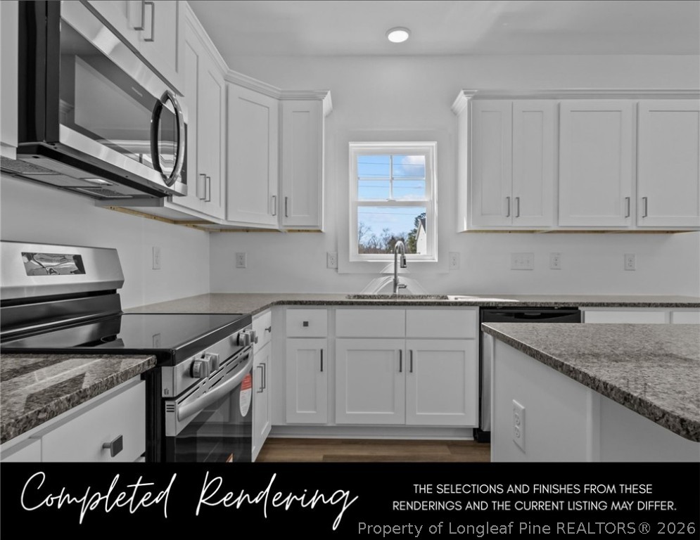 152 South View Spur Road Raeford, NC 28376 - Photo 4 of 9 a kitchen with stainless steel appliances granite countertop a stove a sink and a microwave