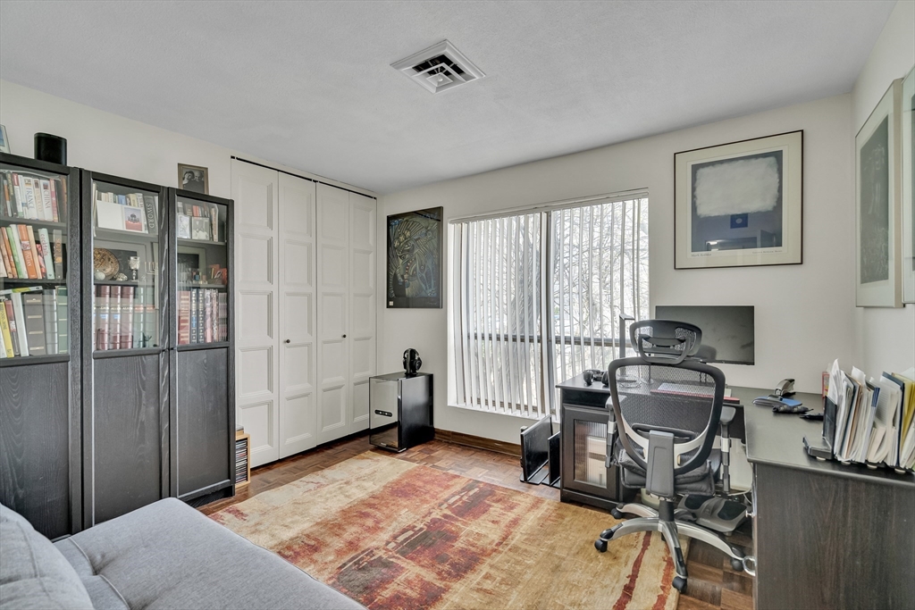 405 Langley Road, Unit 6 Newton, MA 02459 - Photo 38 of 42 a bedroom with furniture and a window