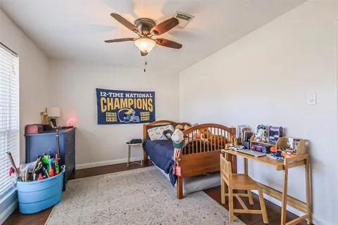 a bedroom with furniture and a window