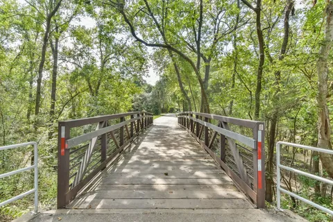 a view of deck with wooden floor and fence