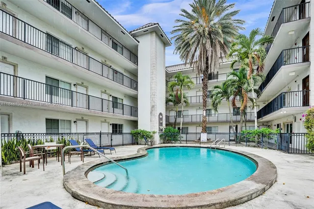 a view of a swimming pool with a patio
