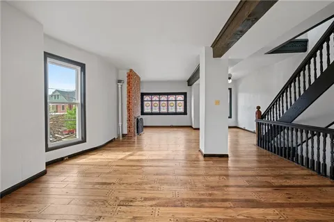 a bathroom with a sink a mirror and a window