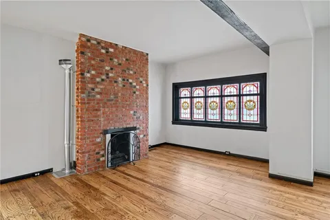 a view of an entryway with wooden floor and staircase