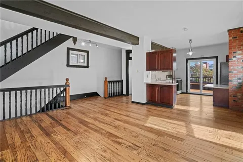 a kitchen with stainless steel appliances granite countertop a sink stove and cabinets