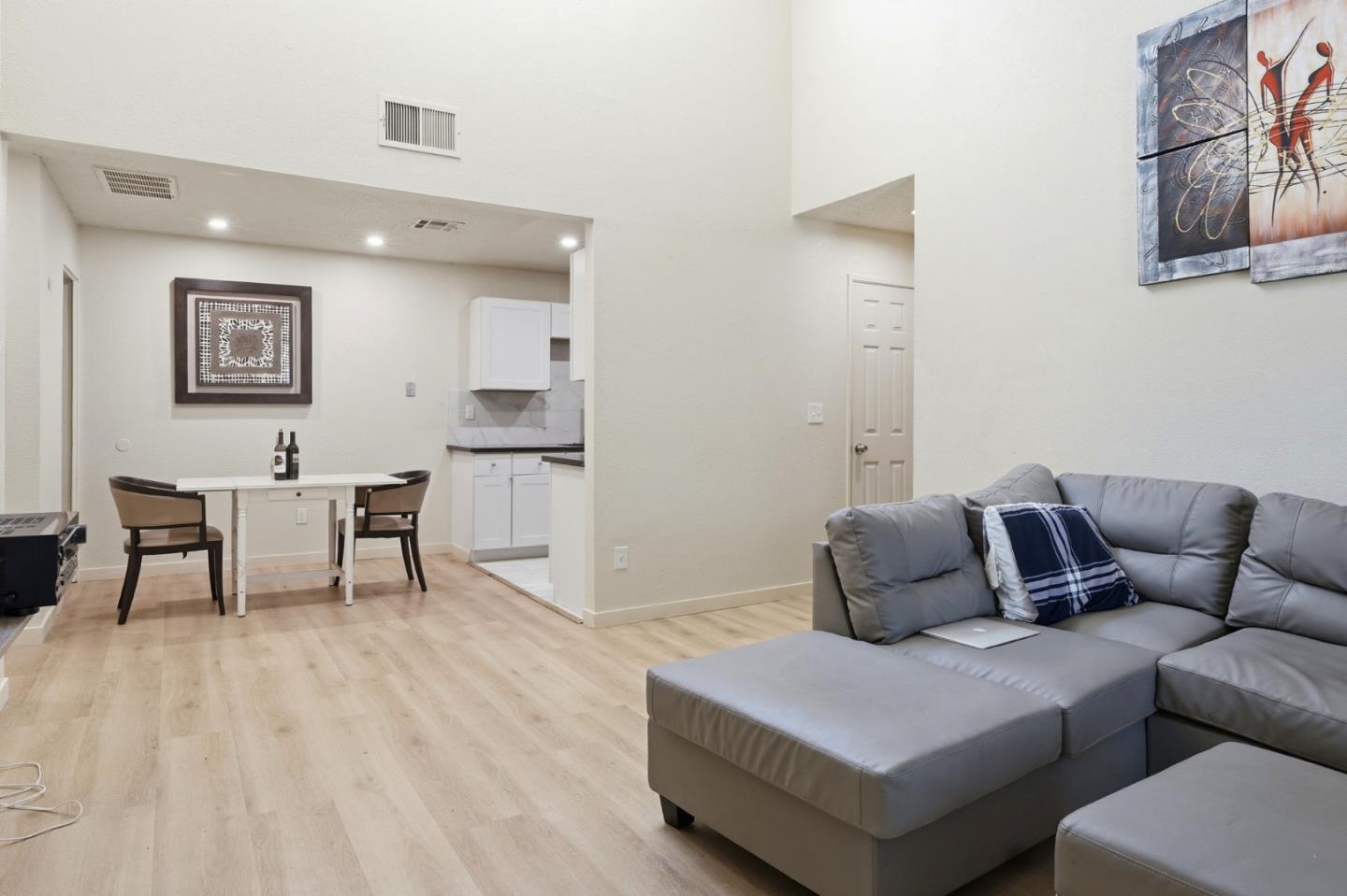 7283 Florin Road, Unit 8 Sacramento, CA 95828 - Photo 9 of 35 a living room with furniture and a wooden floor