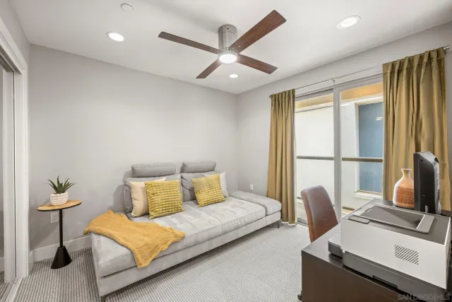 a bedroom with furniture and a window