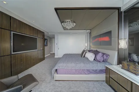 a bedroom with a bed and a walk in closet