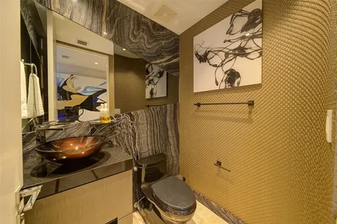 a bathroom with a toilet and a sink