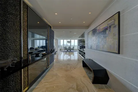 a lobby with furniture and window