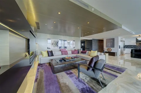 a living room with furniture and a rug