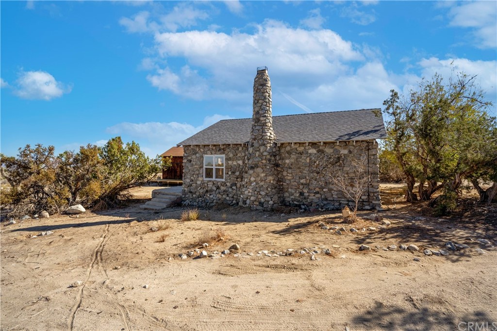 438 Smoke Tree Road Pinon Hills, CA 92372 - Photo 1 of 1 a front view of a house with a yard