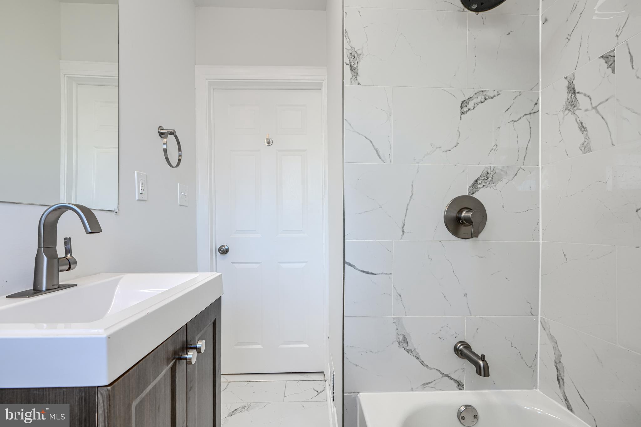 4400 Manorview Road Baltimore, MD 21229 - Photo 12 of 30 a bathroom with a sink and mirror