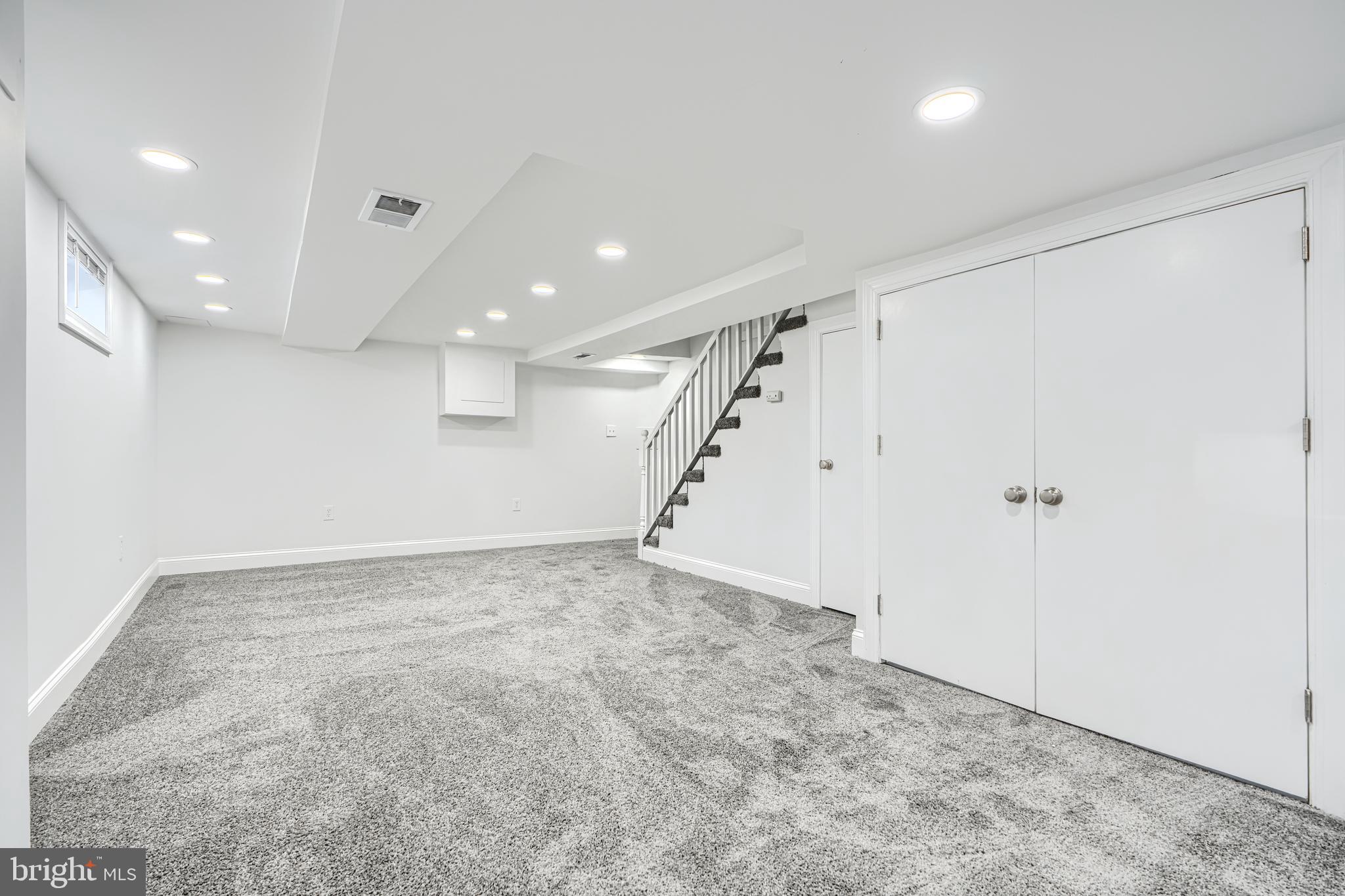 4400 Manorview Road Baltimore, MD 21229 - Photo 17 of 30 an empty room with white walls and stairs