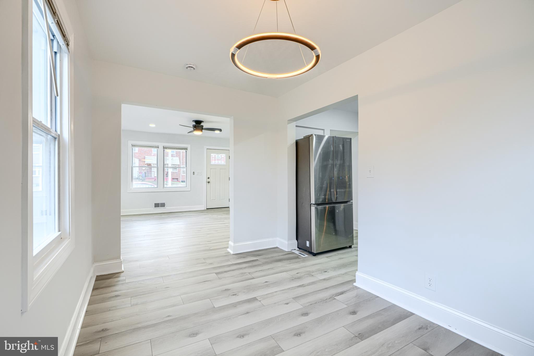 4400 Manorview Road Baltimore, MD 21229 - Photo 6 of 30 a view of a room with wooden floor and mirror