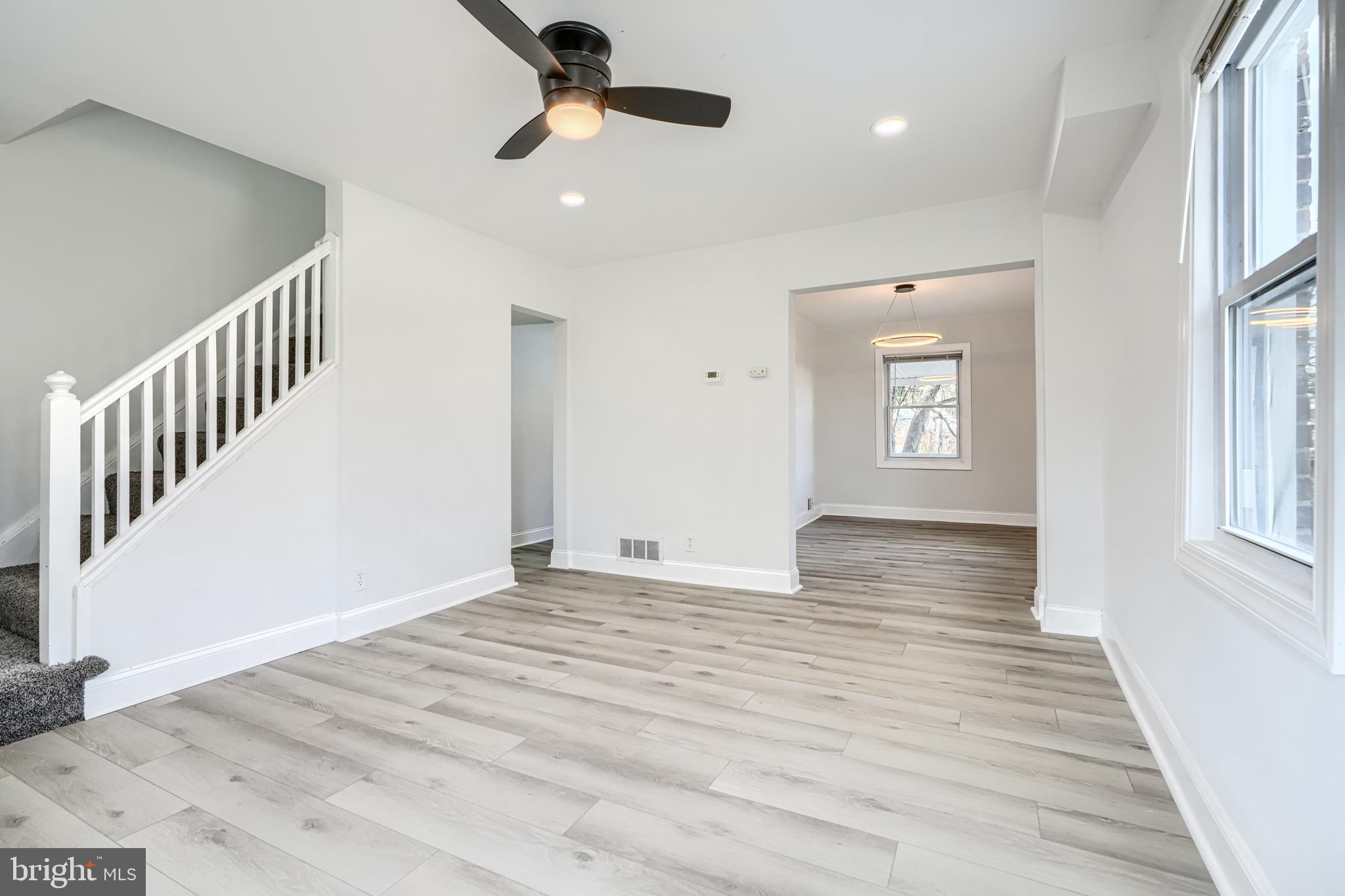 4400 Manorview Road Baltimore, MD 21229 - Photo 9 of 30 a view of an empty room with wooden floor and a window