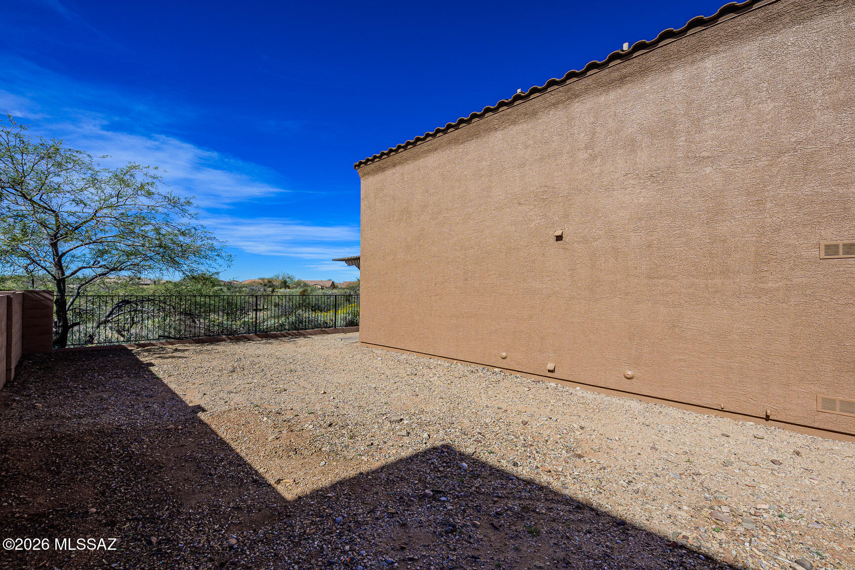728 South Porter Routh Place Vail, AZ 85641 - Photo 32 of 36 a view of a road from a backyard