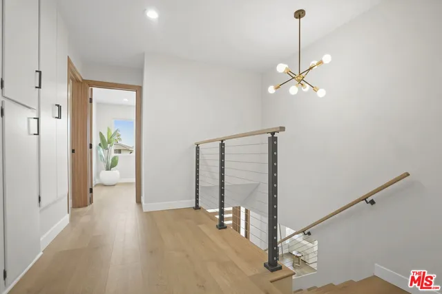 a view of a hallway with a chandelier