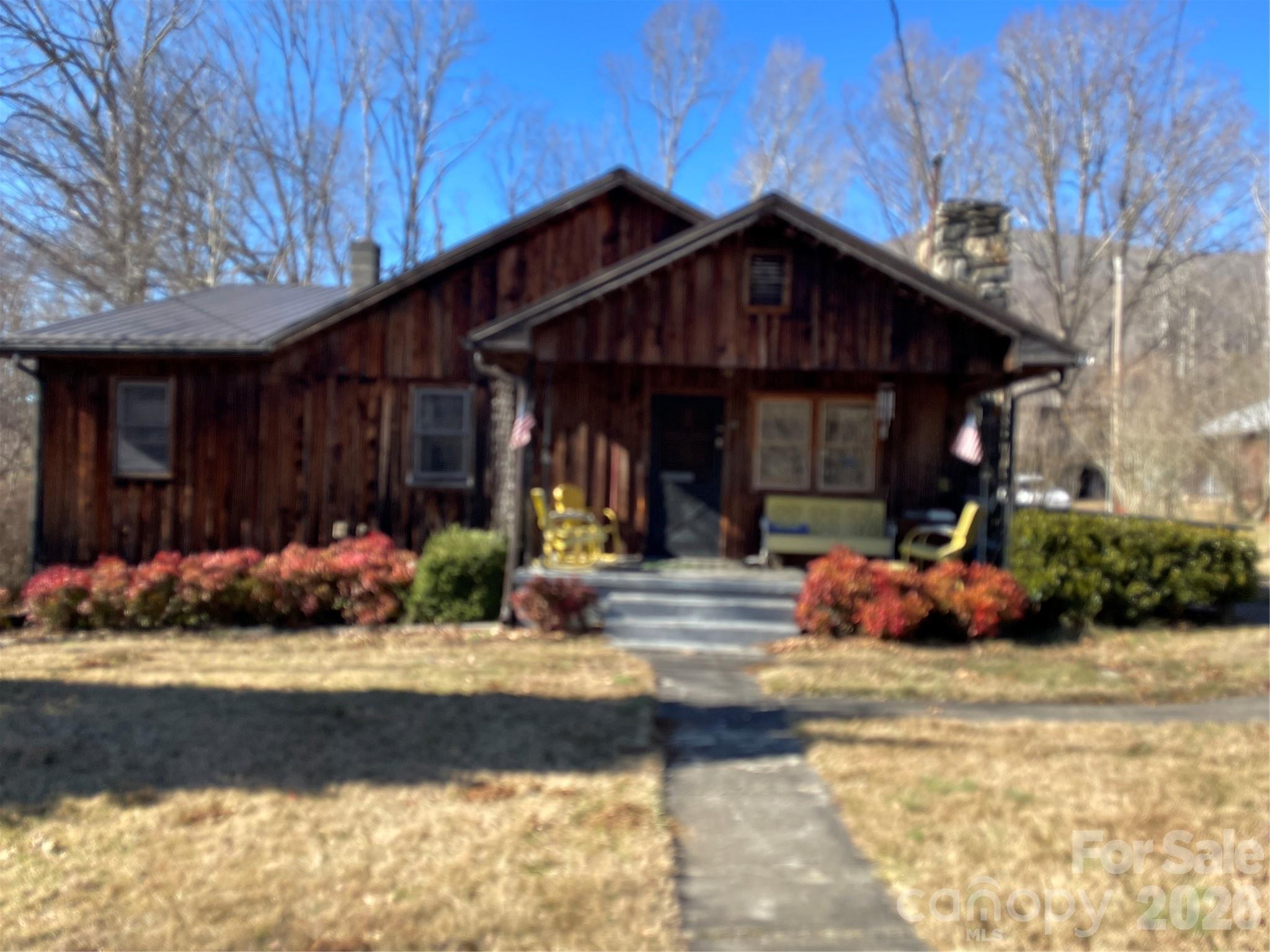 a view of a car park in front of house