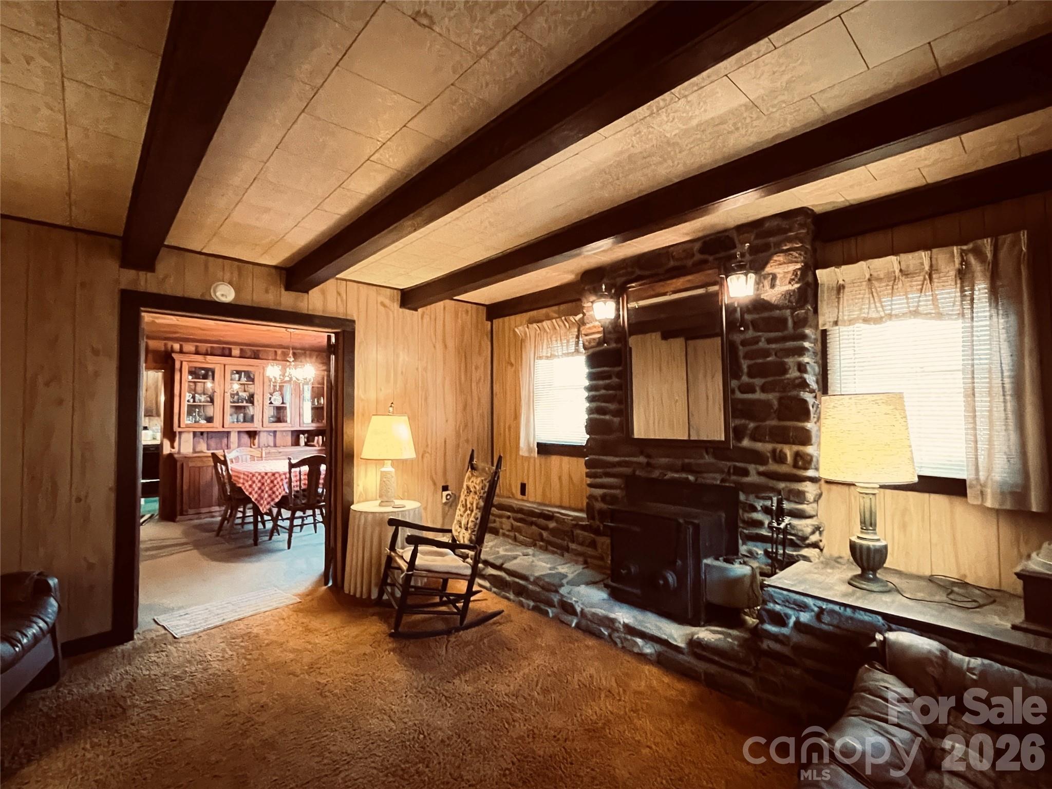29 Cook Town Road Bakersville, NC 28705 - Photo 5 of 14 a living room with furniture and a fireplace