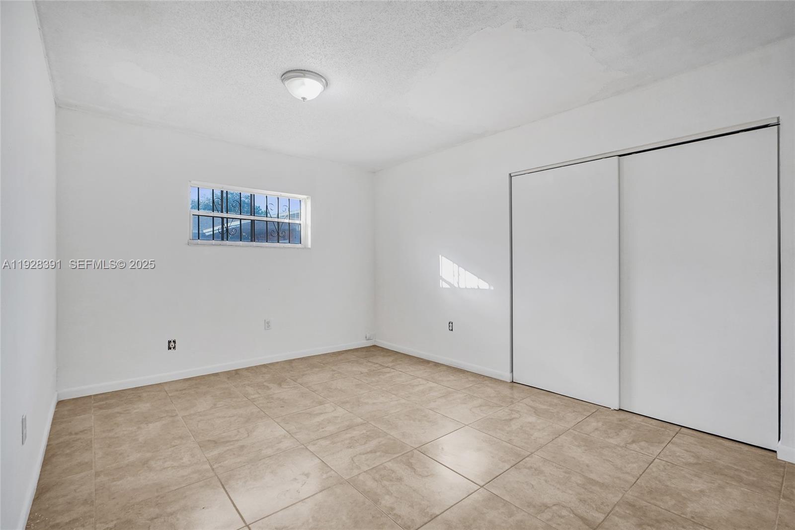 2907 Northwest 103rd Street, Unit 1 Miami, FL 33147 - Photo 16 of 38 a view of an empty room