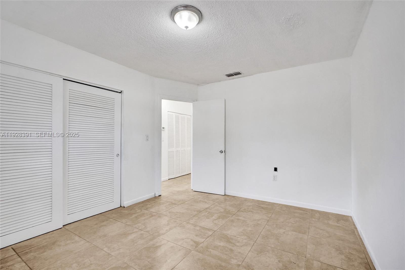2907 Northwest 103rd Street, Unit 1 Miami, FL 33147 - Photo 25 of 38 a view of an empty room