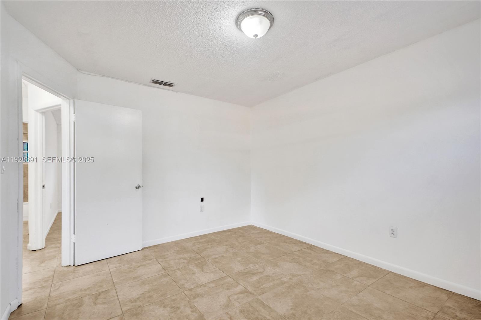 2907 Northwest 103rd Street, Unit 1 Miami, FL 33147 - Photo 26 of 38 a view of empty room