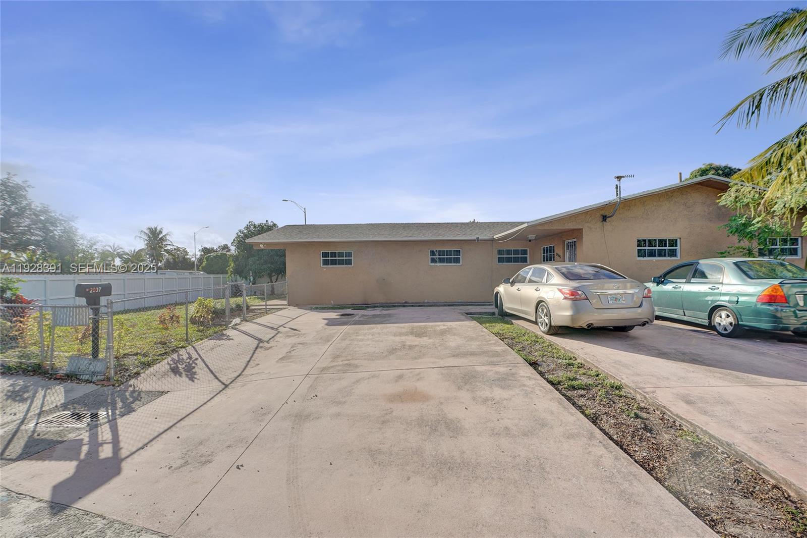 2907 Northwest 103rd Street, Unit 1 Miami, FL 33147 - Photo 33 of 38 a view of a car parked in front of a house