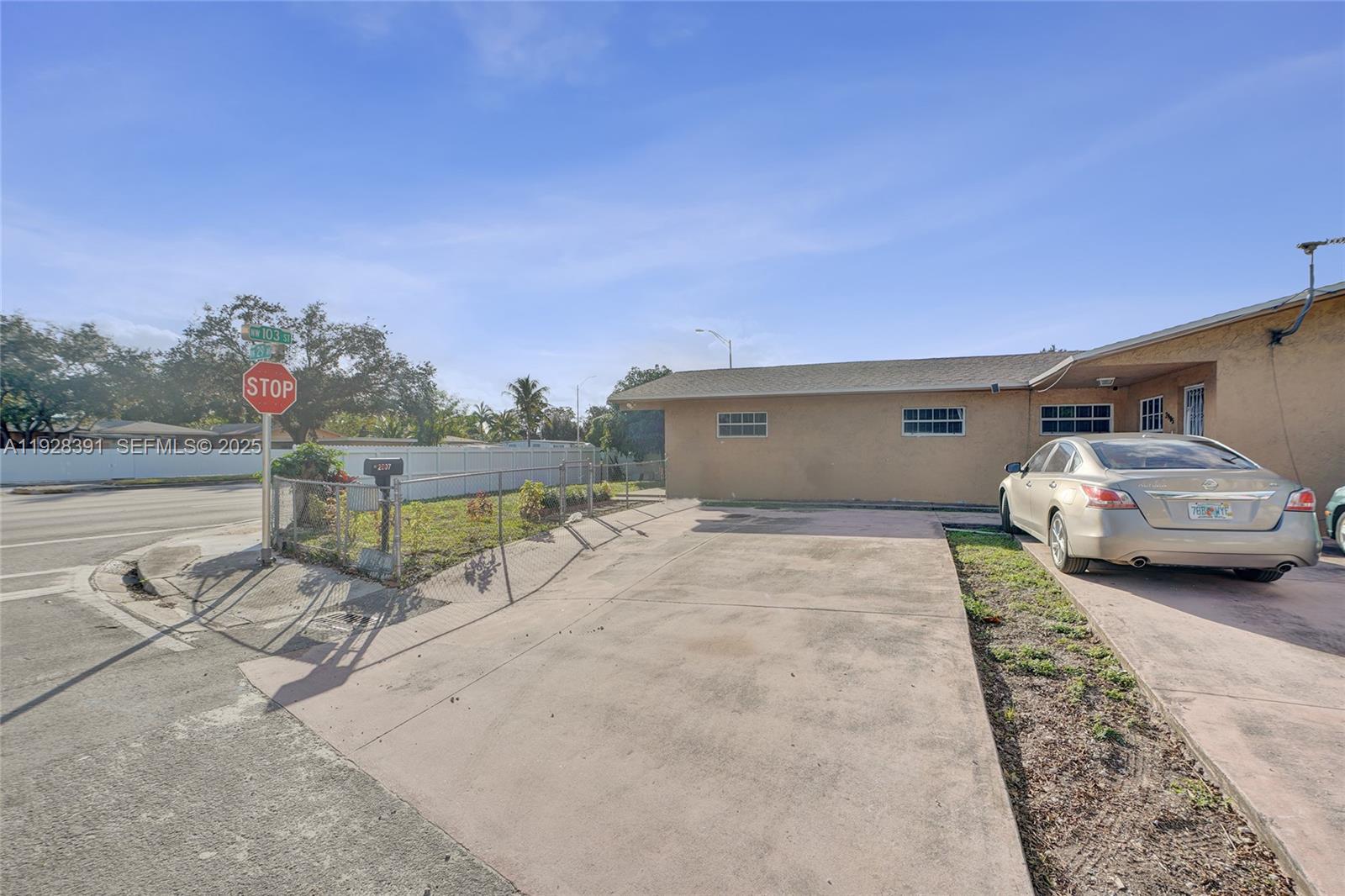 2907 Northwest 103rd Street, Unit 1 Miami, FL 33147 - Photo 34 of 38 a view of a two chairs in the patio