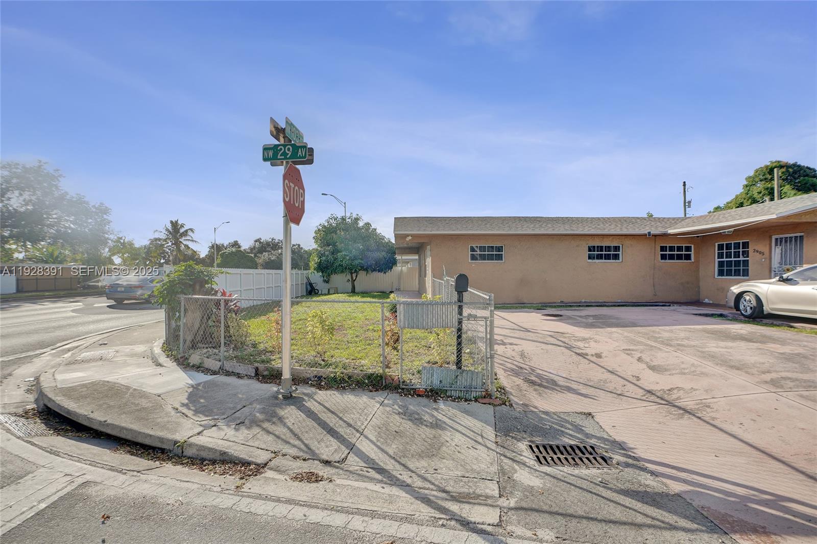2907 Northwest 103rd Street, Unit 1 Miami, FL 33147 - Photo 35 of 38 a front view of a house with a yard