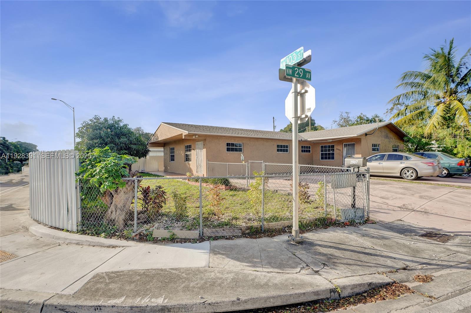 2907 Northwest 103rd Street, Unit 1 Miami, FL 33147 - Photo 36 of 38 a front view of a house with garden